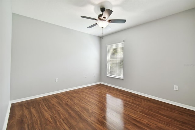 unfurnished room with ceiling fan and dark hardwood / wood-style floors