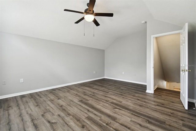 bonus room featuring dark hardwood / wood-style floors, ceiling fan, and lofted ceiling