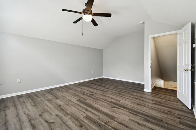 additional living space featuring dark hardwood / wood-style flooring, ceiling fan, and lofted ceiling