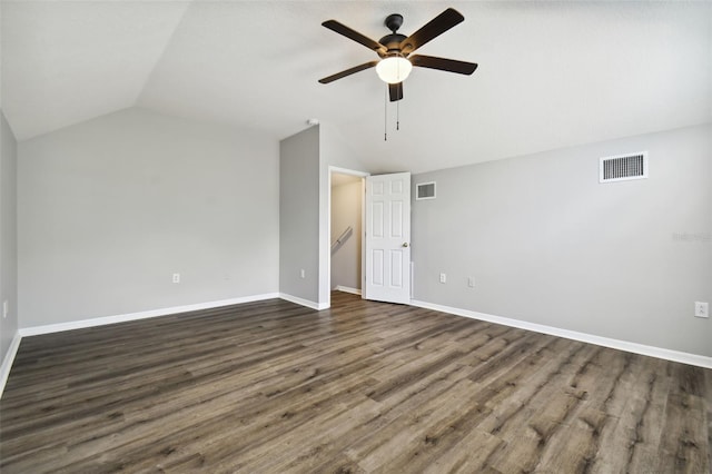 spare room featuring dark hardwood / wood-style floors, ceiling fan, and lofted ceiling