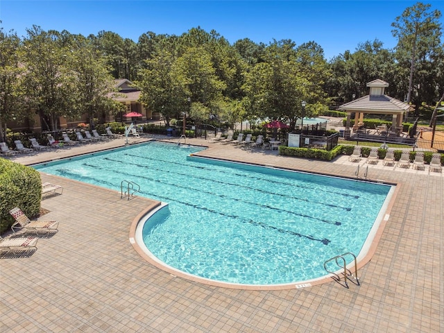 view of pool featuring a patio and a gazebo