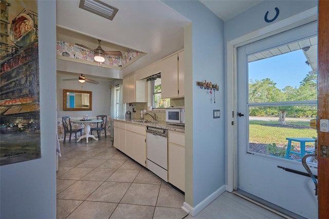 kitchen featuring backsplash, white appliances, ceiling fan, light stone counters, and white cabinets