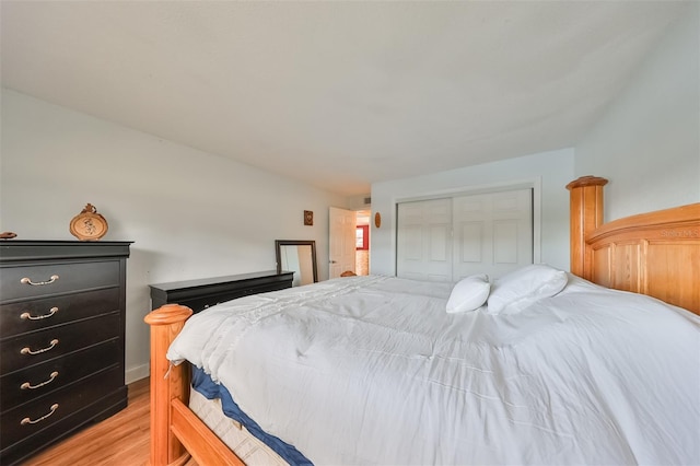 bedroom featuring light hardwood / wood-style flooring and a closet