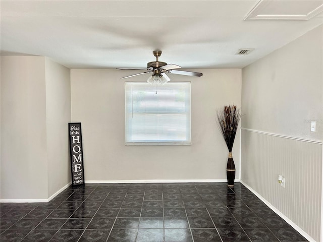 spare room with ceiling fan