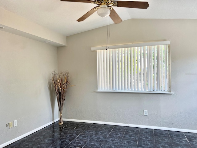 unfurnished room featuring ceiling fan and vaulted ceiling