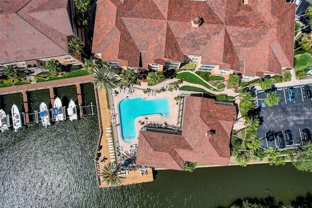 birds eye view of property featuring a water view