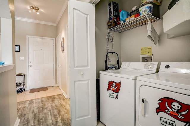 washroom with laundry area, independent washer and dryer, light wood-type flooring, and ornamental molding