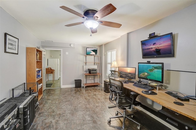 tiled office space featuring ceiling fan