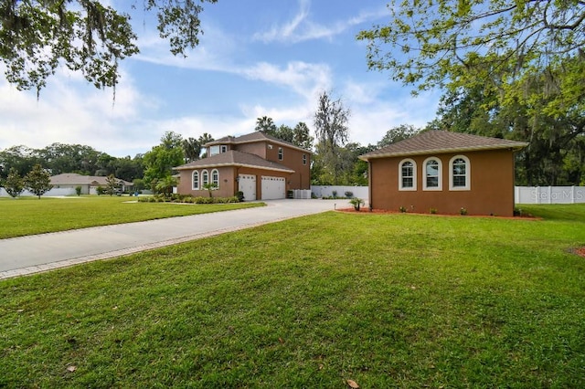 view of front of house with a garage and a front yard