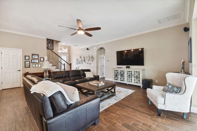 living room with crown molding and wood-type flooring