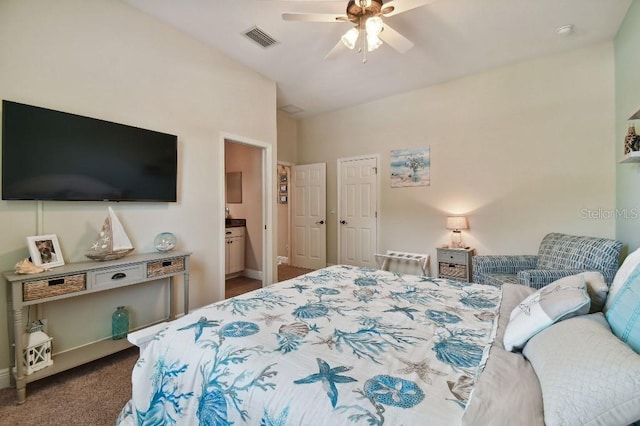 carpeted bedroom featuring ceiling fan and ensuite bathroom