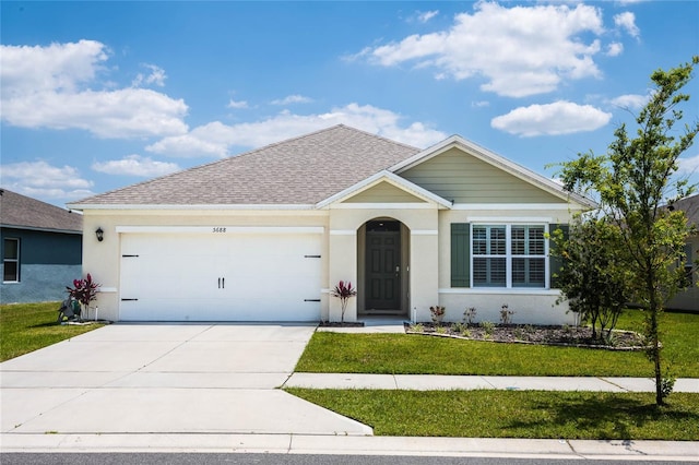 ranch-style home featuring a garage and a front lawn