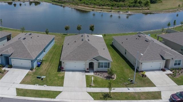 birds eye view of property with a water view