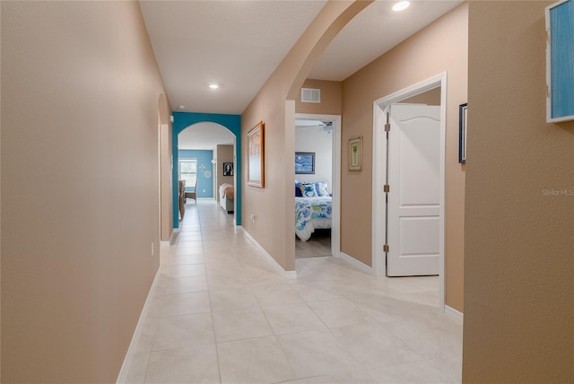 hallway with light tile flooring