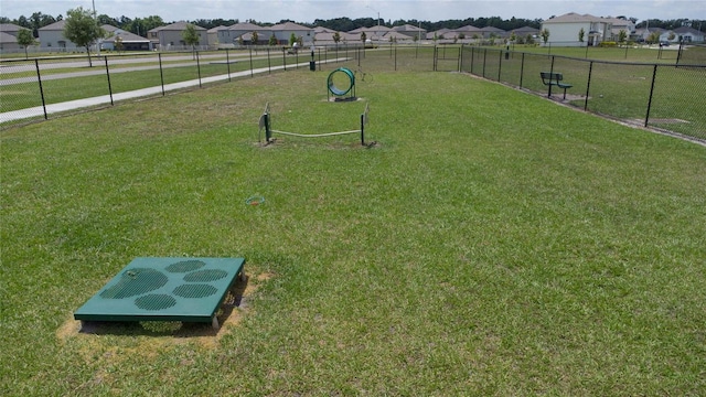 view of nearby features featuring a lawn