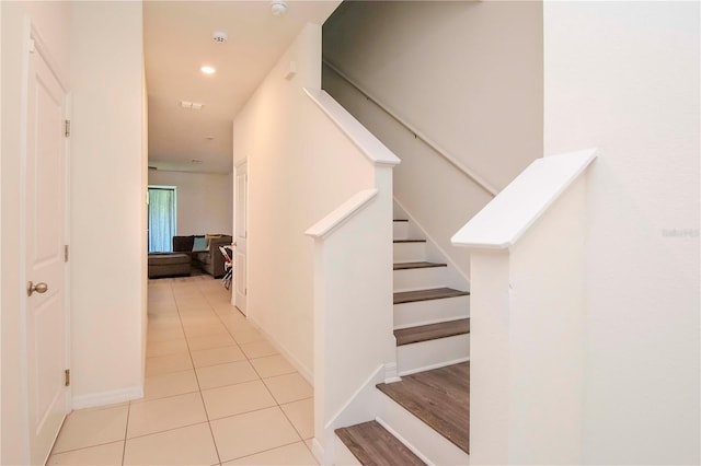 staircase with tile patterned flooring