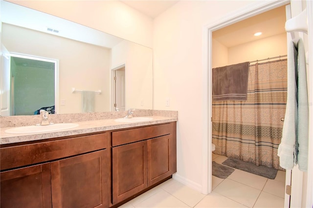 bathroom with vanity, a shower with shower curtain, toilet, and tile patterned flooring