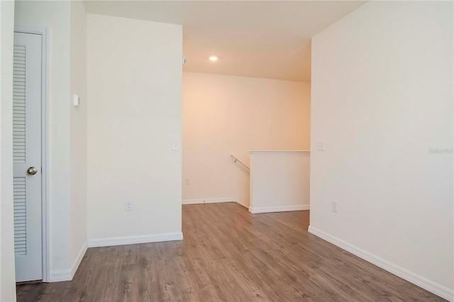 empty room with light hardwood / wood-style flooring