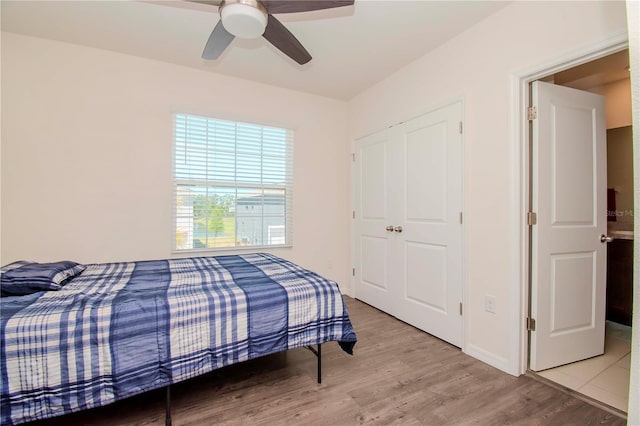 bedroom featuring light hardwood / wood-style floors and ceiling fan