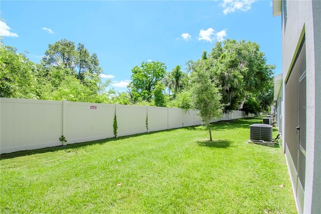 view of yard featuring central AC unit