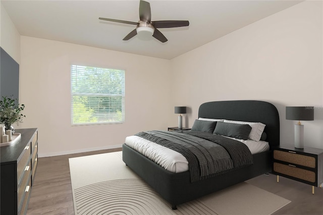 bedroom with dark hardwood / wood-style floors and ceiling fan