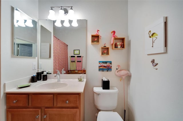 bathroom with vanity and toilet