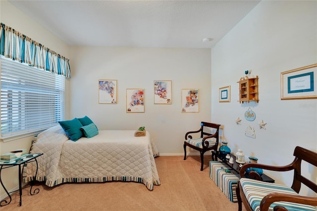 bedroom featuring light carpet