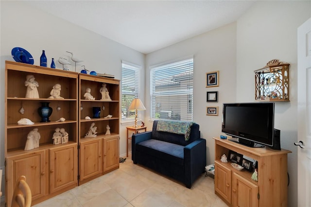 sitting room featuring light tile patterned flooring