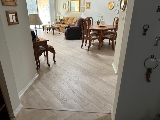 dining space featuring light wood-type flooring