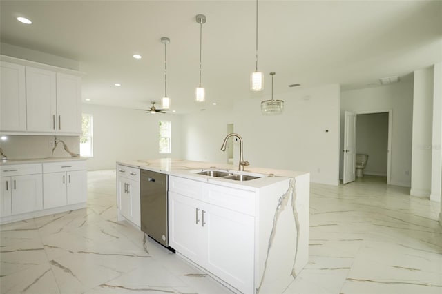 kitchen featuring a center island with sink, hanging light fixtures, sink, white cabinets, and dishwasher