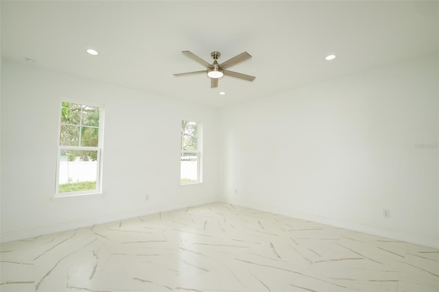 unfurnished room with ceiling fan