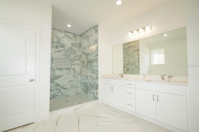 bathroom with vanity and a shower with shower door