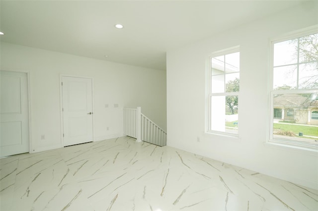 spare room with a wealth of natural light