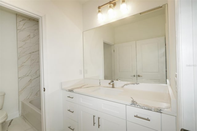 bathroom with vanity and toilet