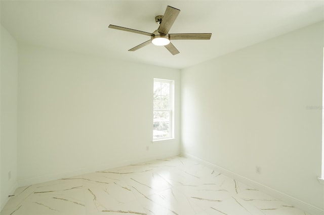 spare room with ceiling fan