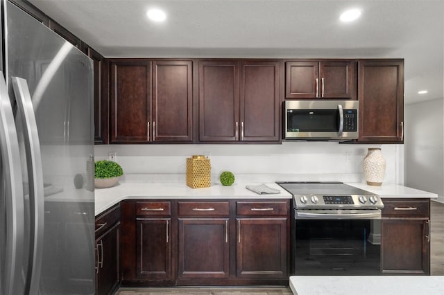 kitchen featuring light hardwood / wood-style floors and stainless steel appliances