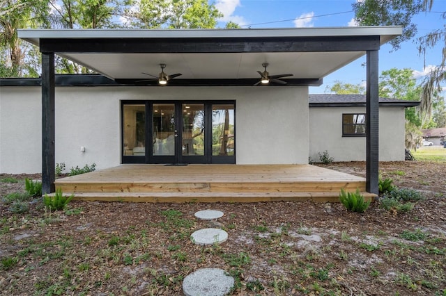 rear view of house with ceiling fan, a deck, and french doors