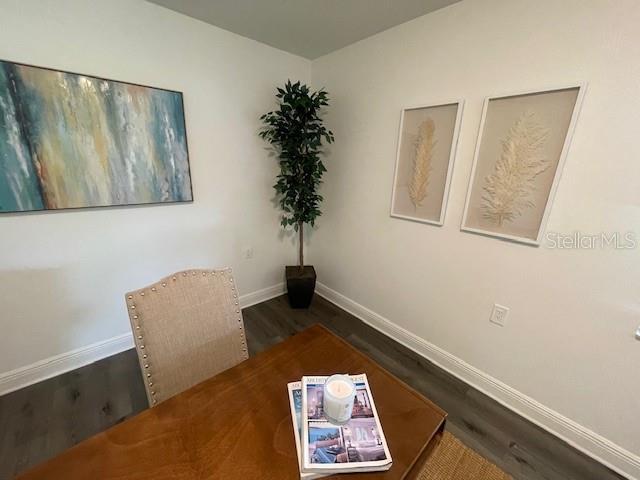 sitting room with dark hardwood / wood-style floors