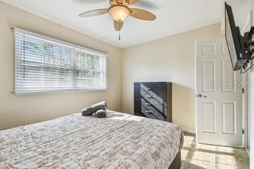 bedroom featuring ceiling fan