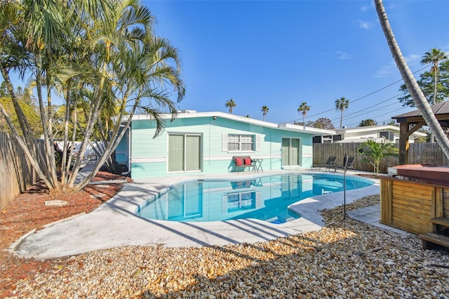 view of pool featuring a hot tub