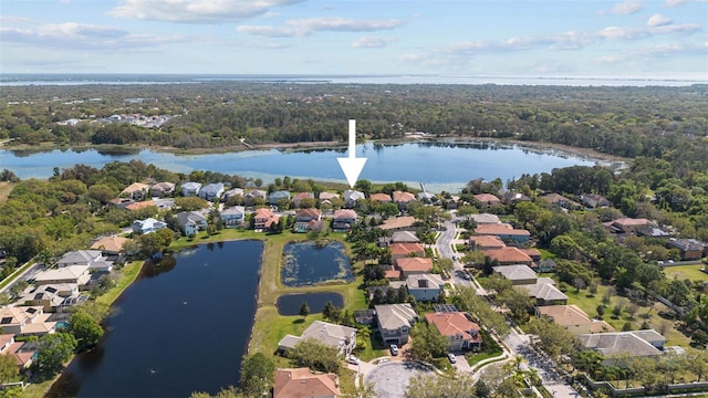 drone / aerial view with a water view