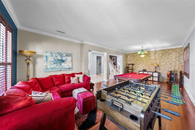 living room with ceiling fan, wood-type flooring, ornamental molding, and billiards