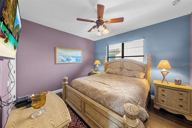 bedroom featuring wood-type flooring and ceiling fan