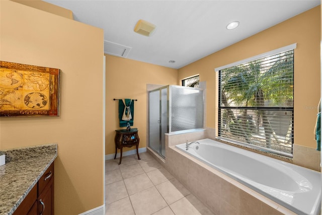 bathroom with independent shower and bath, vanity, and tile patterned flooring