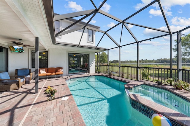 view of pool with glass enclosure, ceiling fan, an in ground hot tub, a patio area, and outdoor lounge area