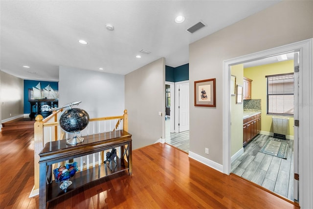 hallway featuring hardwood / wood-style floors