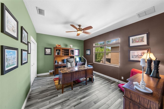 office area featuring a textured ceiling, ceiling fan, and hardwood / wood-style floors