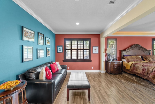 bedroom with hardwood / wood-style flooring and crown molding