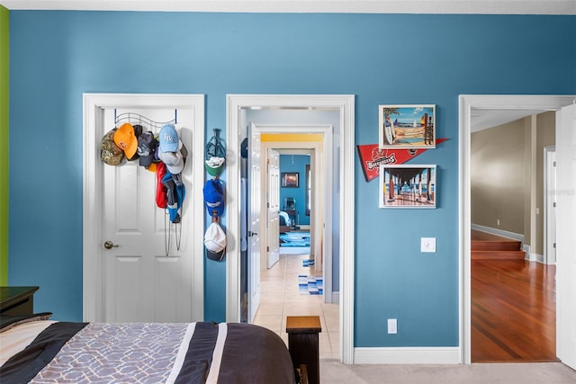 tiled bedroom with a closet