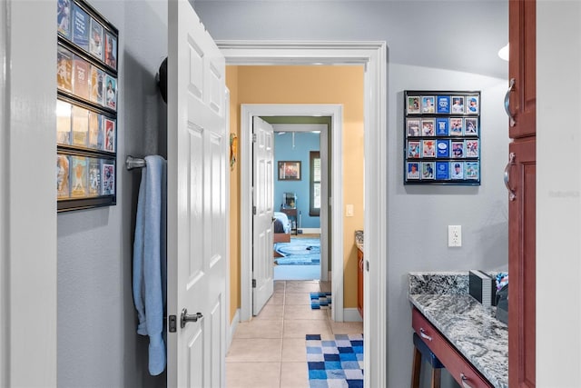 bathroom with tile patterned flooring and lofted ceiling